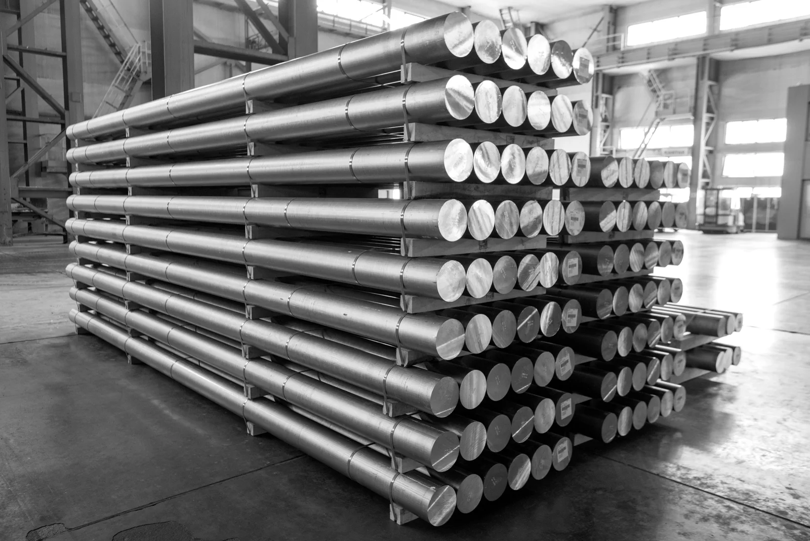 Extrusion billets on the plant floor, treated black and white